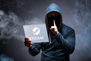 Hacker che fa il gesto del silenzio e tiene una lavagna con su impresso il logo Steam