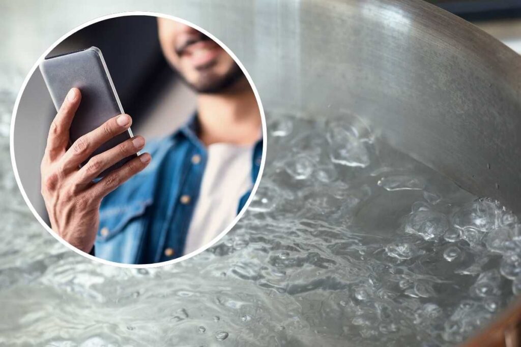 Acqua che bolle, uomo con cellulare